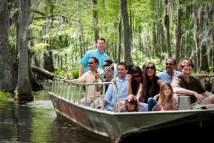 travelers on a swamp tour of honey island in louisiana